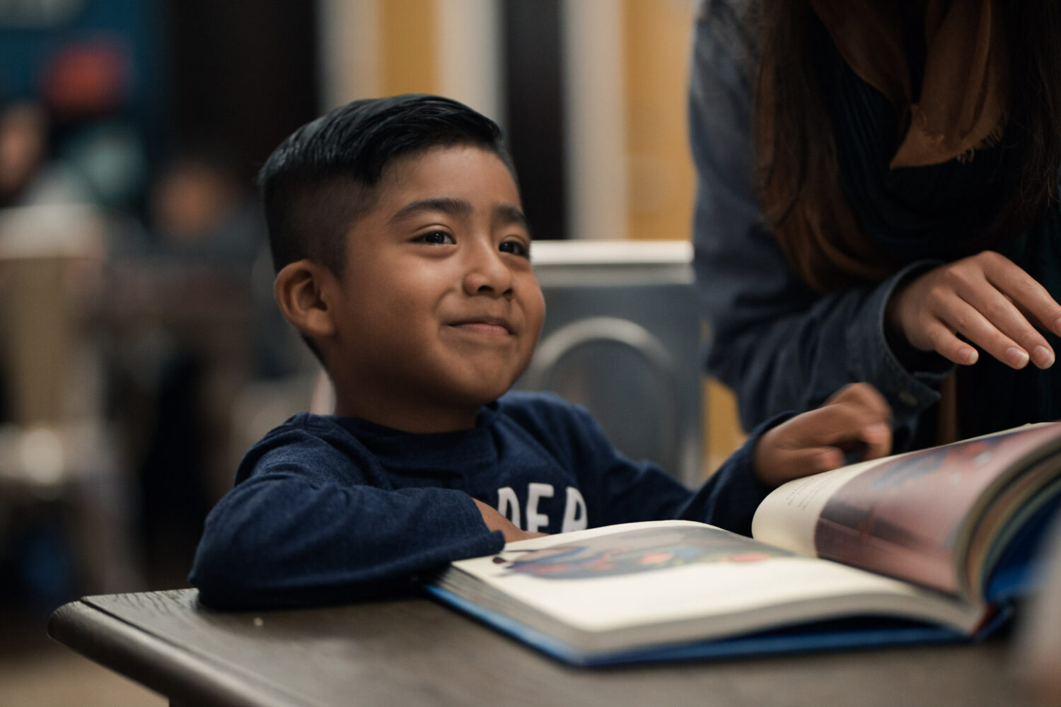 An 826DC student writes in the writing center