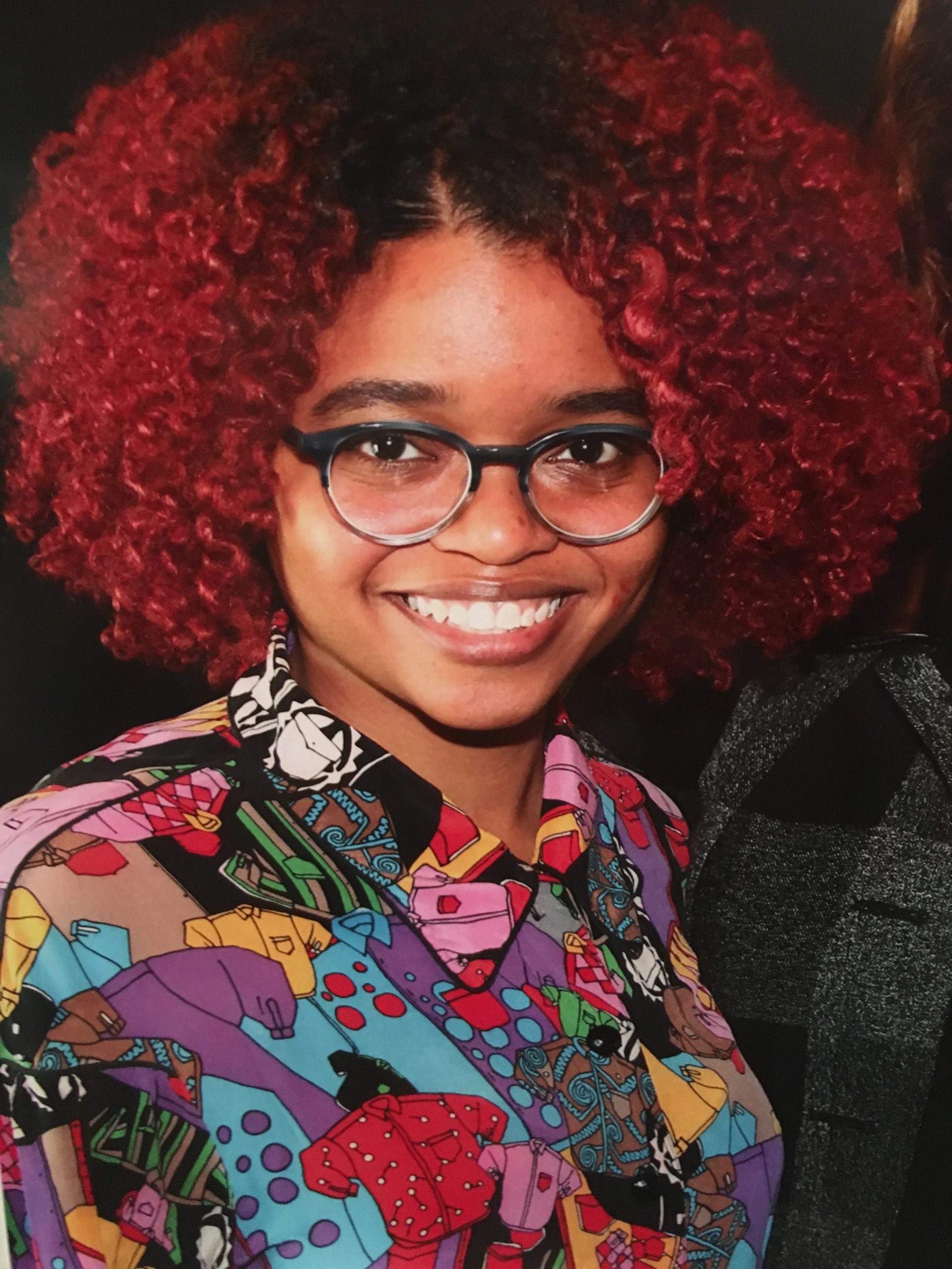 Shayna Baggatts-Porter, the Community Programs Manager, smiling and wearing glasses.